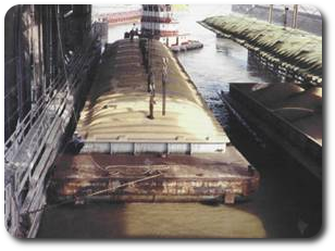 Photo of a barge being moved into position to await unloading at Destrehan, Louisiana.