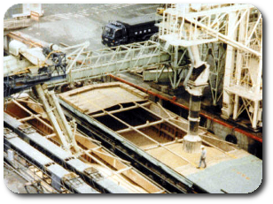 Photo of loading grain from ship to barge.